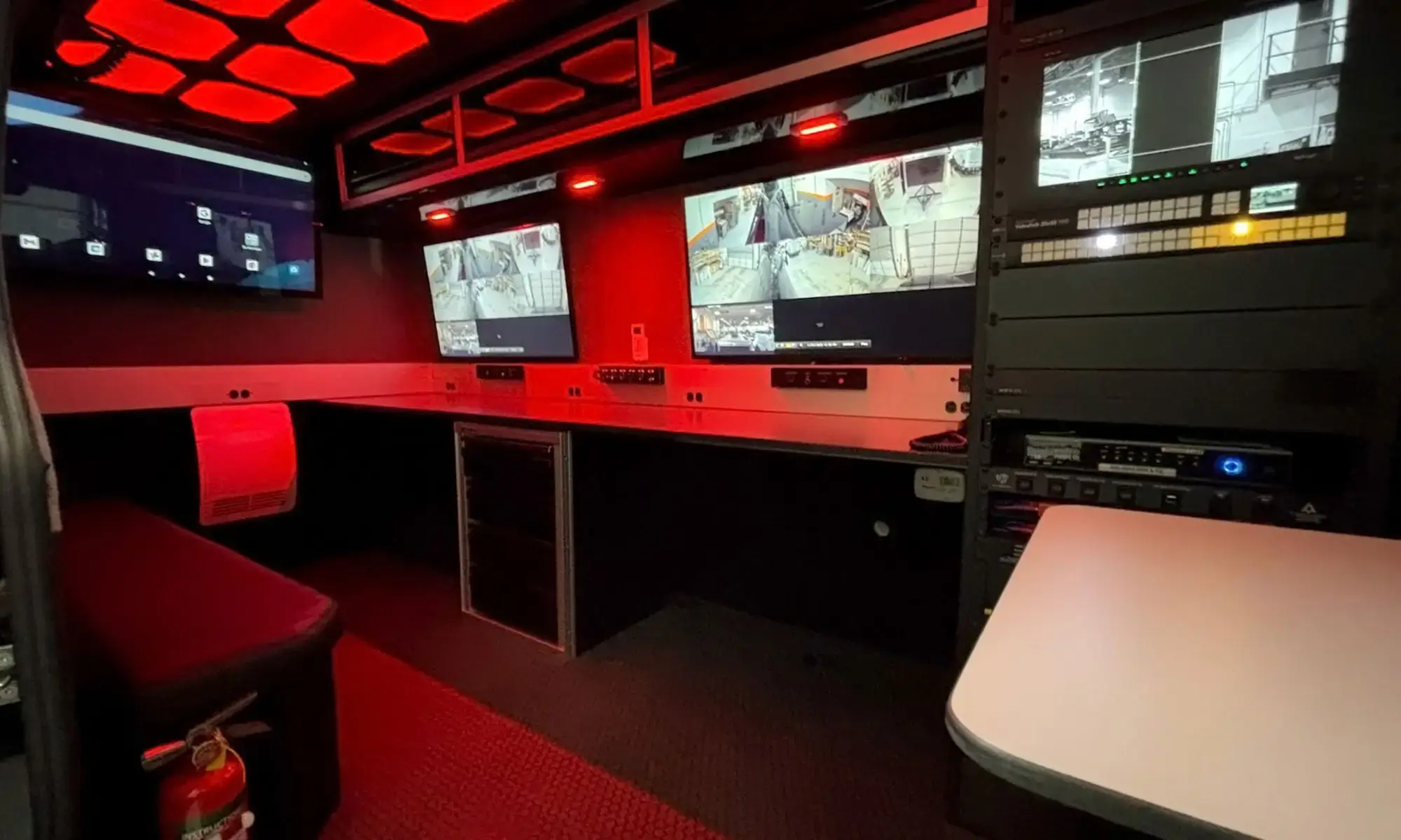 Interior shot of the mobile command vehicle for FIFA 2026 showcasing the red lighting mode.