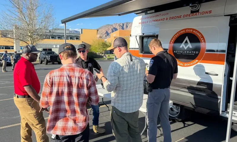 Accelerated Tactical runs a table answering questions about real-world drone operation in front of their mobile UAS demo platform.